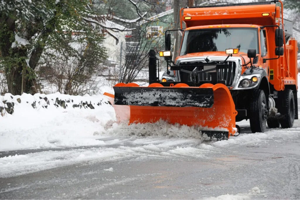 snow plowing ice and snow off roadway