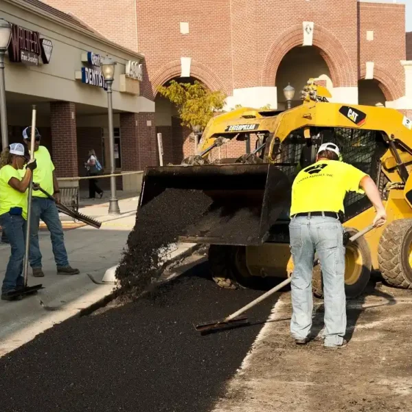 Kansas Asphalt employees working on parking lot at retail jobsite.