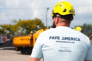 back of a pave america employee wearing a pave america/make a wish partnership t-shirt