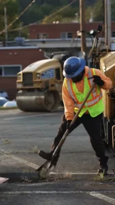pave america employee using a shovel