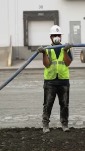 pave america employee holding up a tube