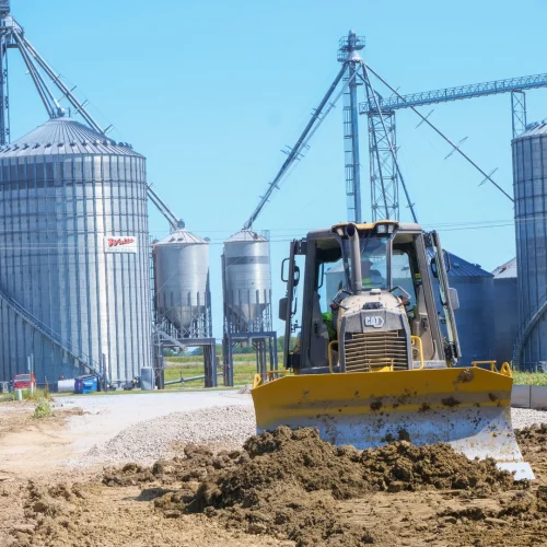 ground excavation with grain silos in the background
