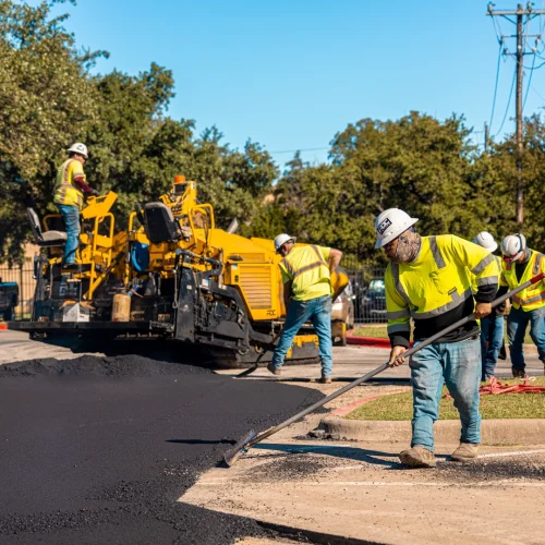 RDC Paving employees raking asphalt