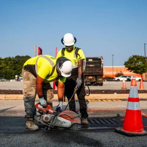 saw-cutting asphalt pavement around a drain