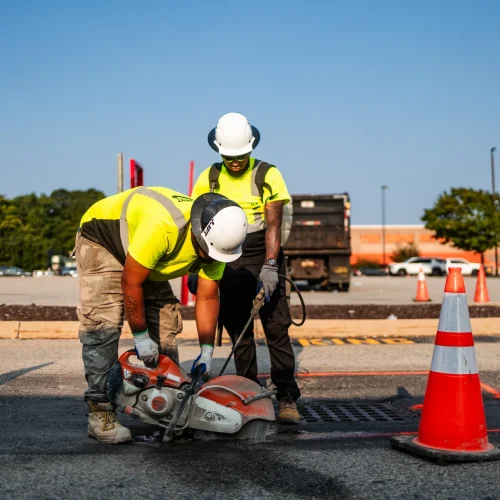 saw-cutting asphalt pavement around a drain