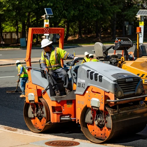 brothers paving employee operating an asphalt roller