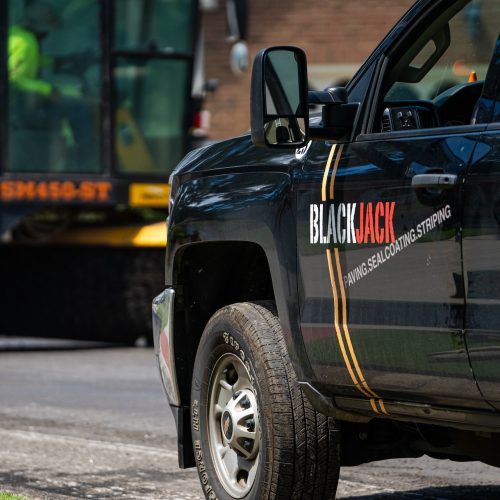 Close up of Blackjack Paving work truck.