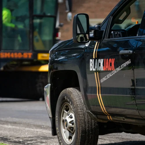 Close up of Blackjack Paving work truck.