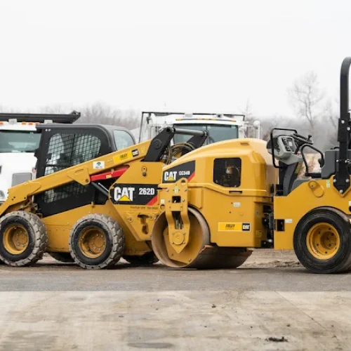 California Asphalt CAT machine on site at commercial paving job.