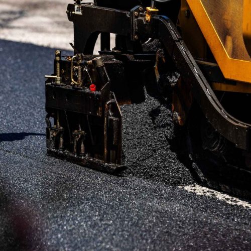 Close up view of Chamberlain Contractors performing paving services.