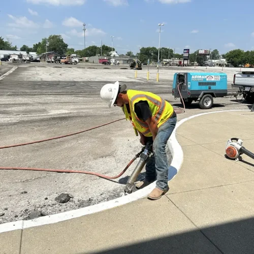 Cincinnati Asphalt employee performing services on site at commercial job.