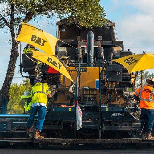 Cincinnati Asphalt employees working on site at a commercial paving job.