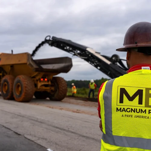 back of a magnum paving employee