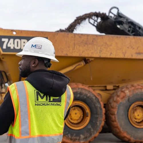 back of a magnum paving employee