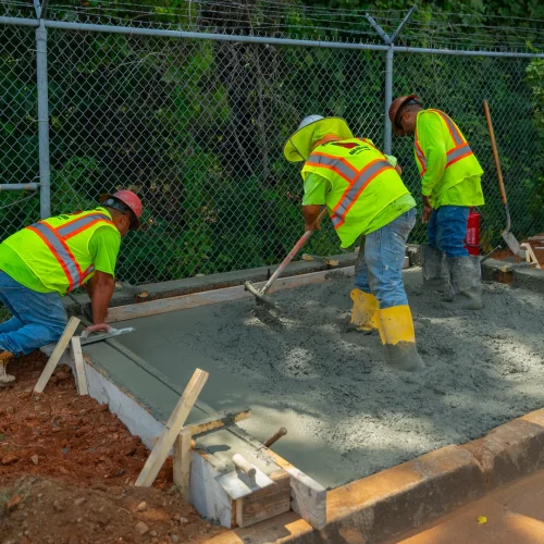 PKS Paving employees pouring concrete
