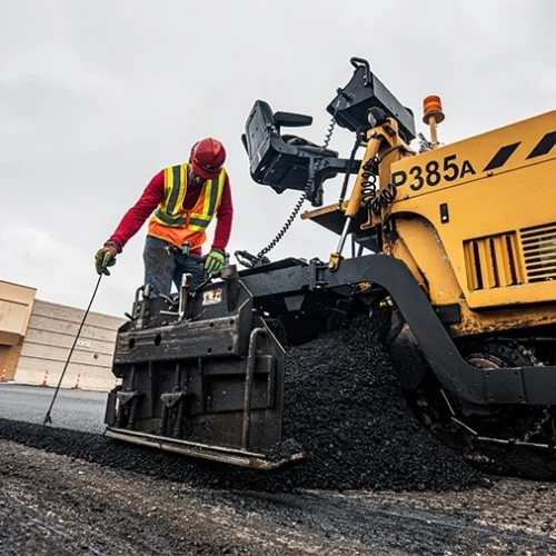 Encore Pavement employee working on commercial paving jobsite.
