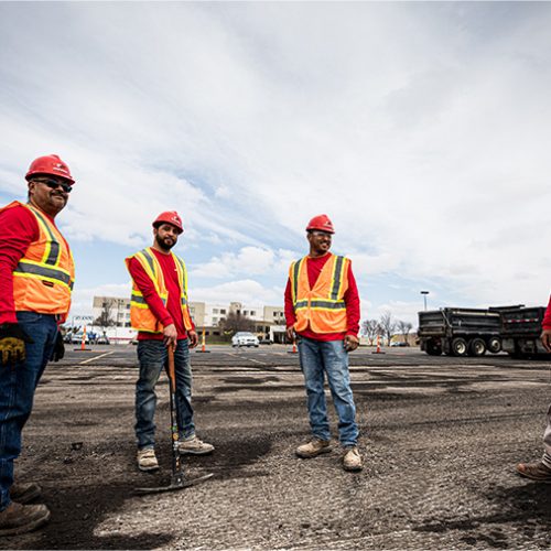 Four Encore Pavement employees at jobsite.