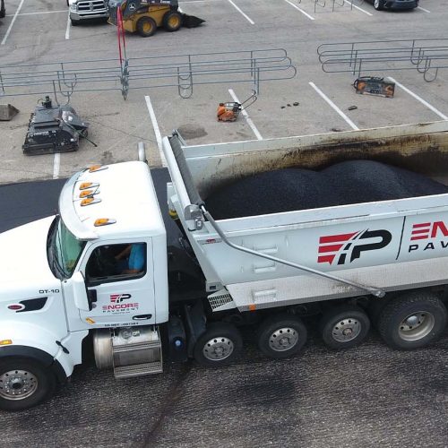 Encore Pavement truck featuring company logo.