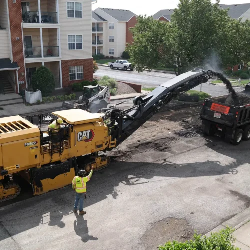 Finley Asphalt & Sealing milling truck on commercial jobsite.