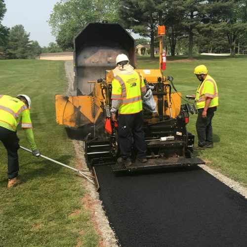 Finley Asphalt & Sealing employees paving.