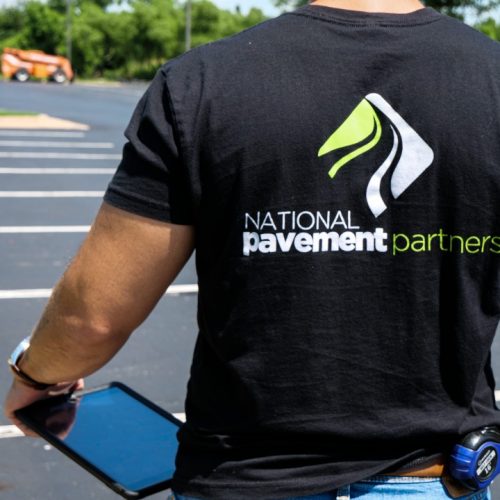 Man wearing National Pavement Partners shirt from behind.