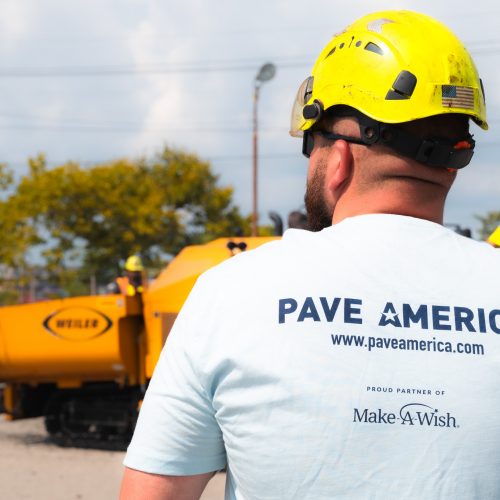 Pave America employee wearing a company shirt from behind.