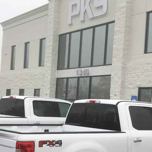 PKS Paving building with trucks parked in front.