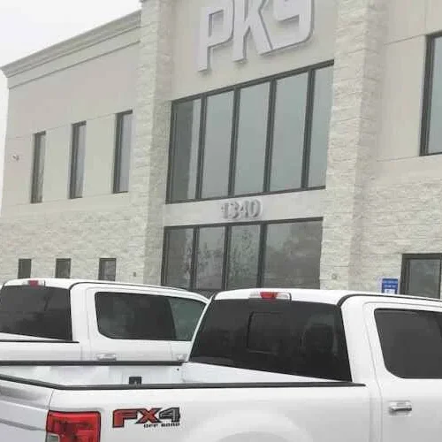 PKS Paving building with trucks parked in front.