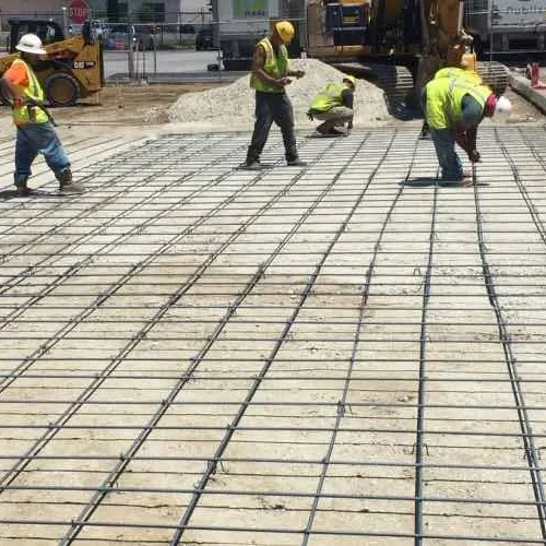 PKS Paving employees working on concrete on commercial job site.