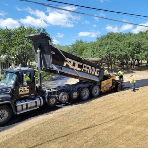RDC Paving branded truck on job site.