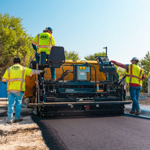 RDC Paving employees paving asphalt on job site.
