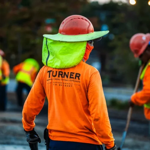 Turner Asphalt employee with company logo on shirt.