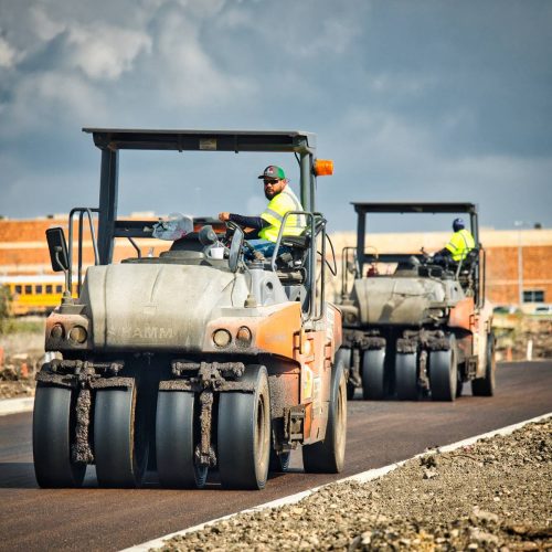alpha paving employees on asphalt rollers