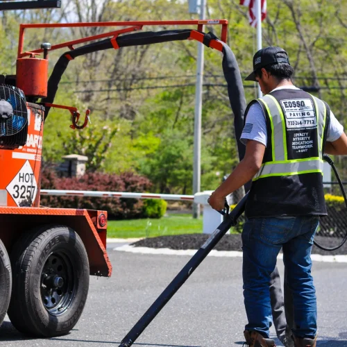 Eosso Brothers Paving employee on site at commercial paving jobsite.