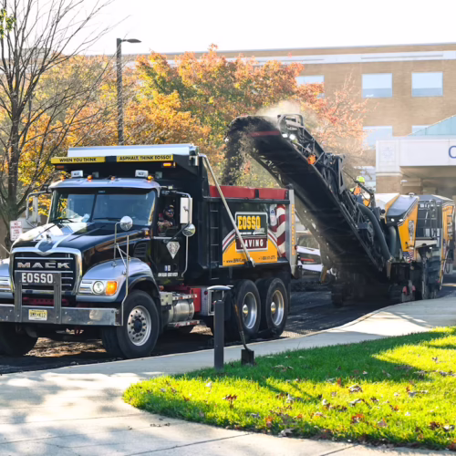 Eosso Brothers Paving company truck on commercial jobsite.