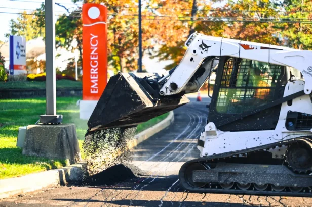 laying down asphalt in a hospital parking lot