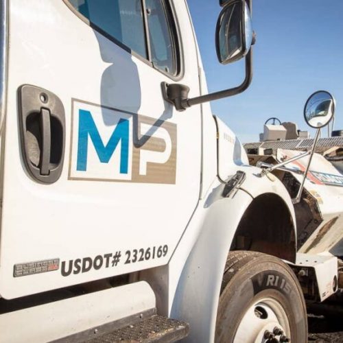Close up of Magnum Paving logo on company truck.