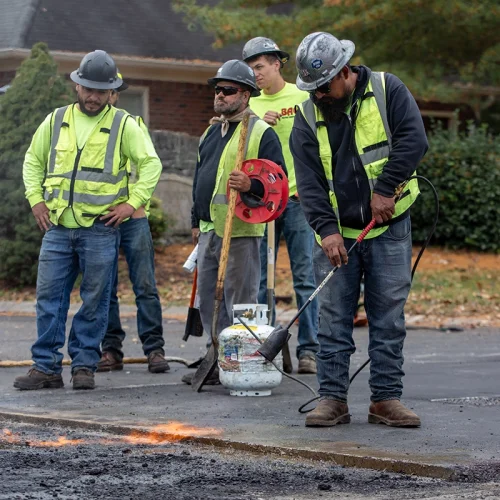 BAC employees working on a street